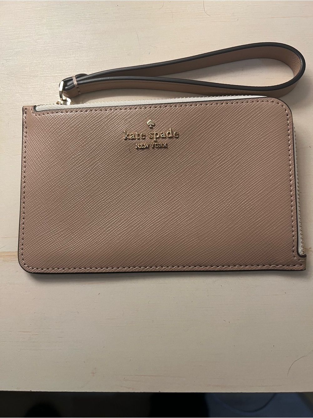 Kate Spade Tan and White Wristlet with Gold Logo